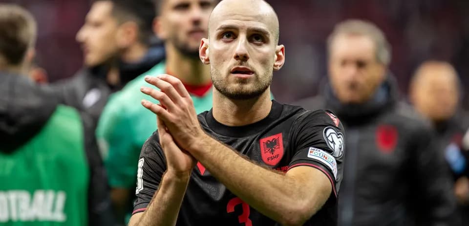 Albanian player applauding fans after the match