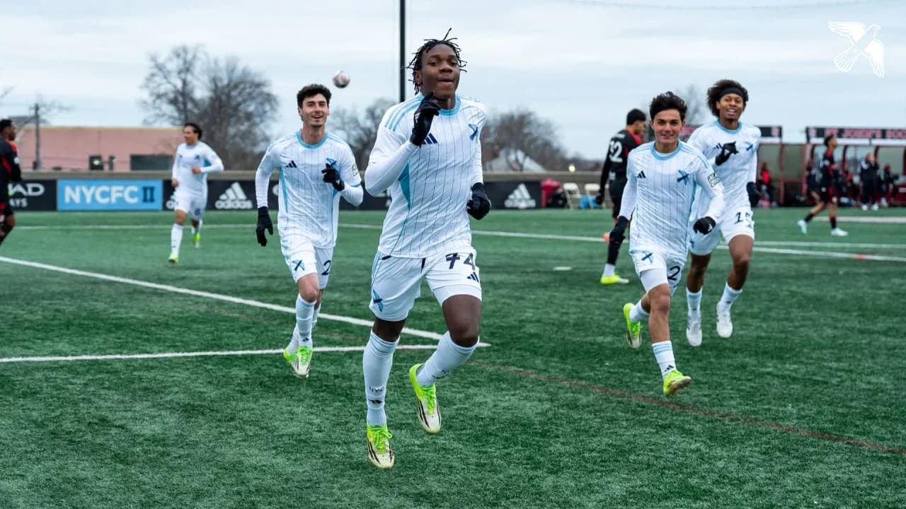 New England II players celebrating a goal