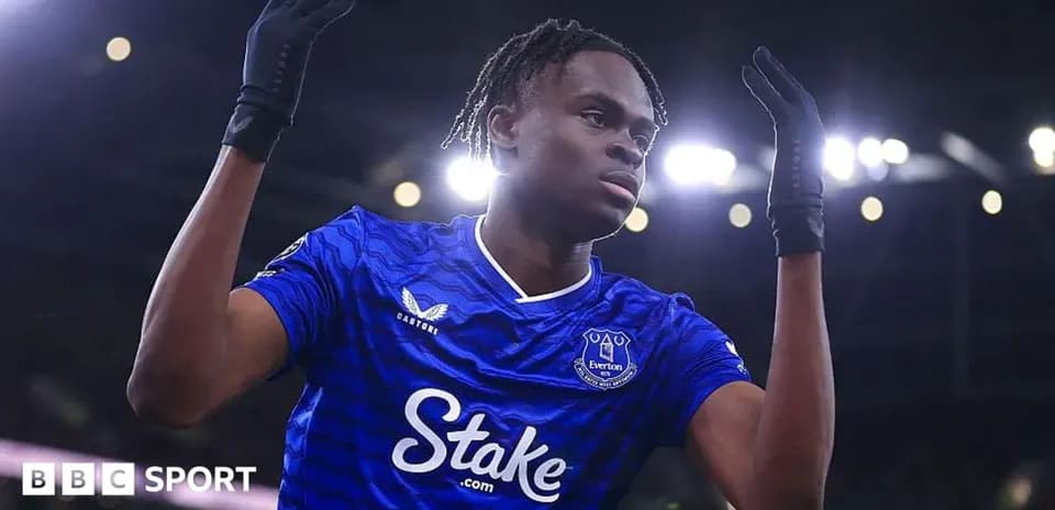 Player celebrating in Everton jersey during match