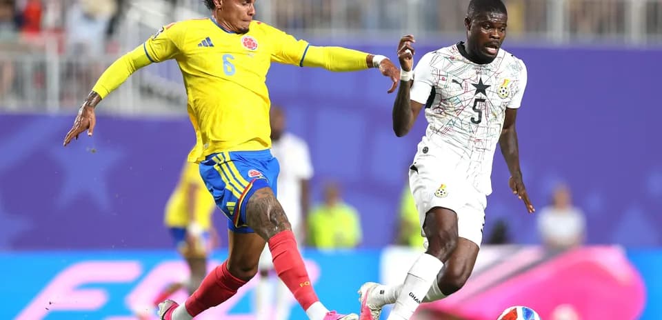 Colombia player challenges Ghana opponent during match