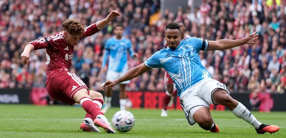 Player tackling opponent during a football match