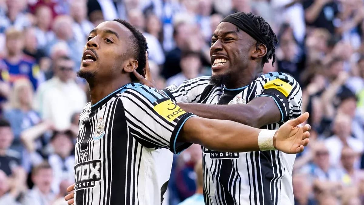 Newcastle players celebrating a goal in stadium