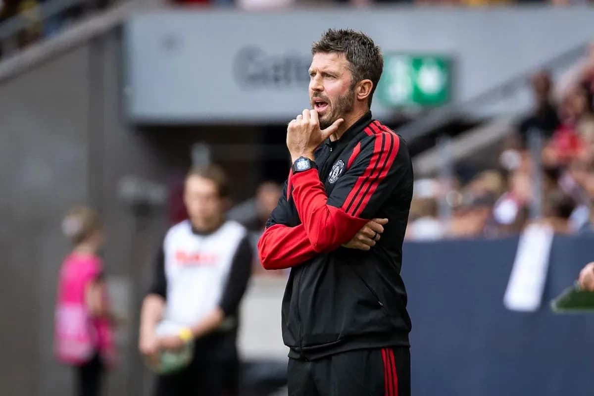 Coach observing match from sidelines with thoughtful expression