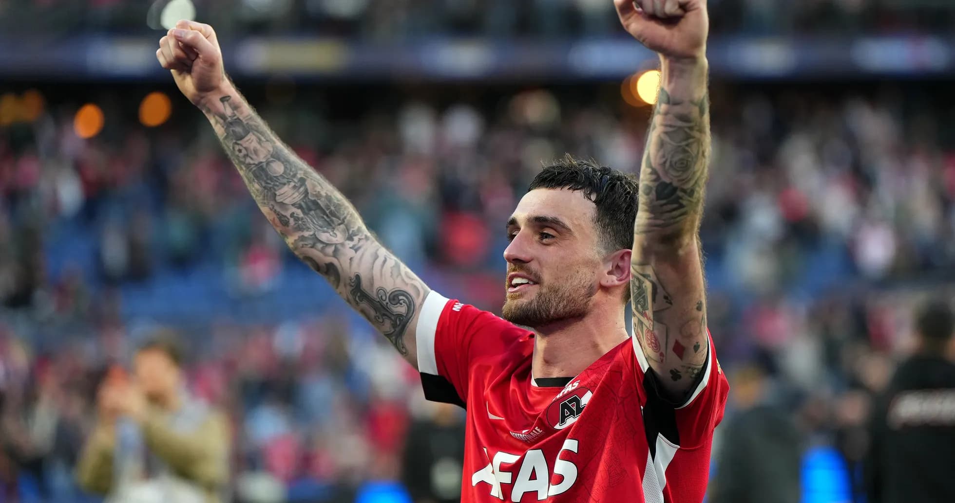 Player celebrating with raised arms after match