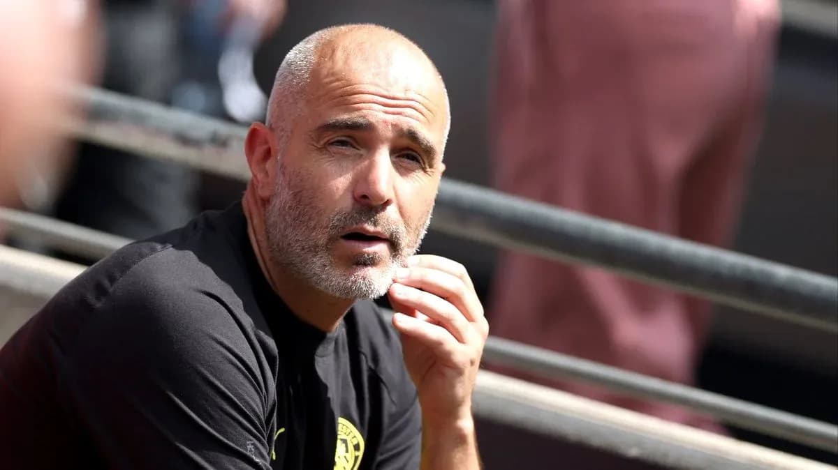 Coach observing the match from the sidelines
