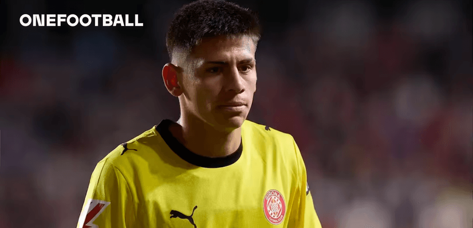 Goalkeeper in yellow jersey walking on the field