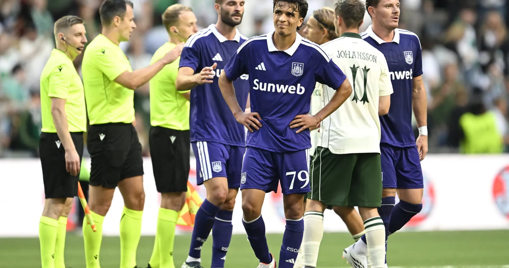 Anderlecht players discussing with referees during match