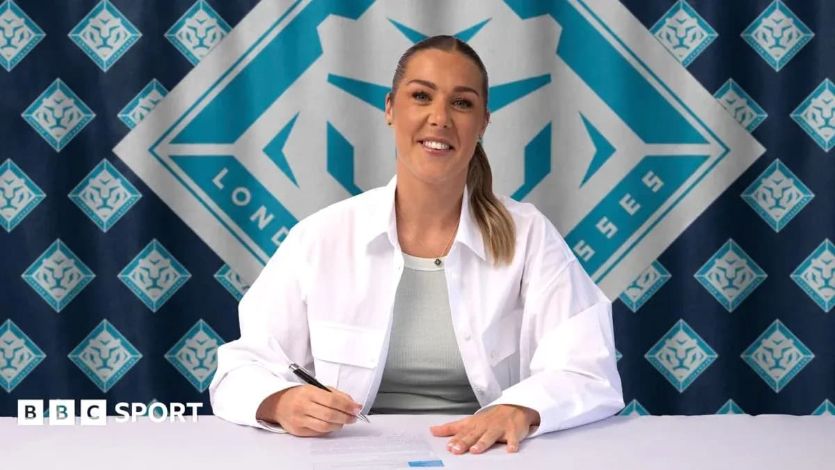 Athlete signing contract at press conference table