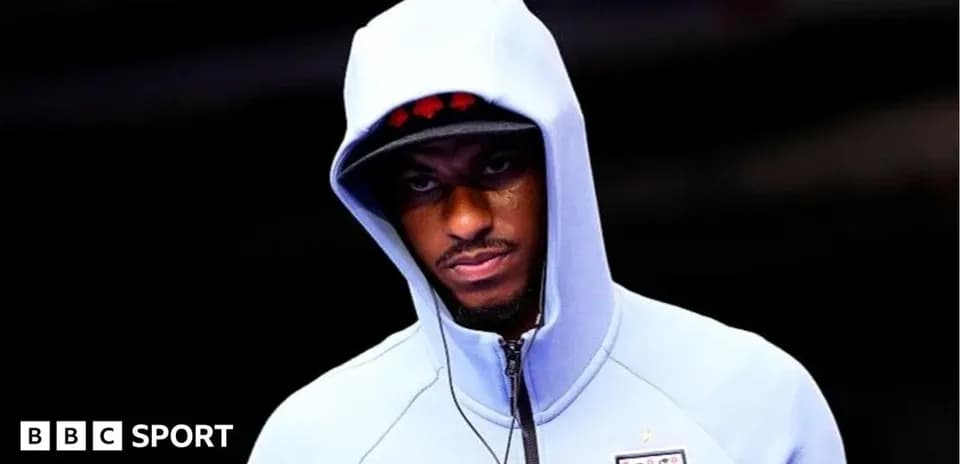 Player wearing a hoodie before the match