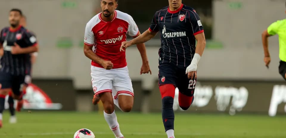 Players competing for the ball in match