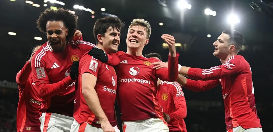 Manchester United players celebrating a goal together