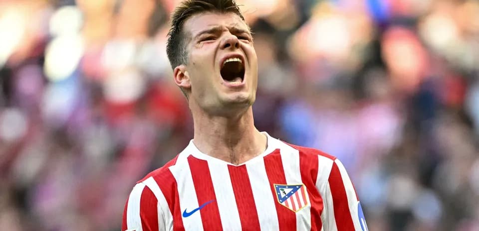 Player celebrating in Atlético Madrid jersey