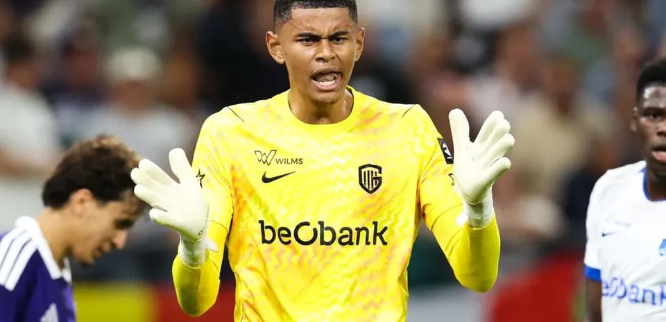 Goalkeeper in yellow jersey gesturing during match