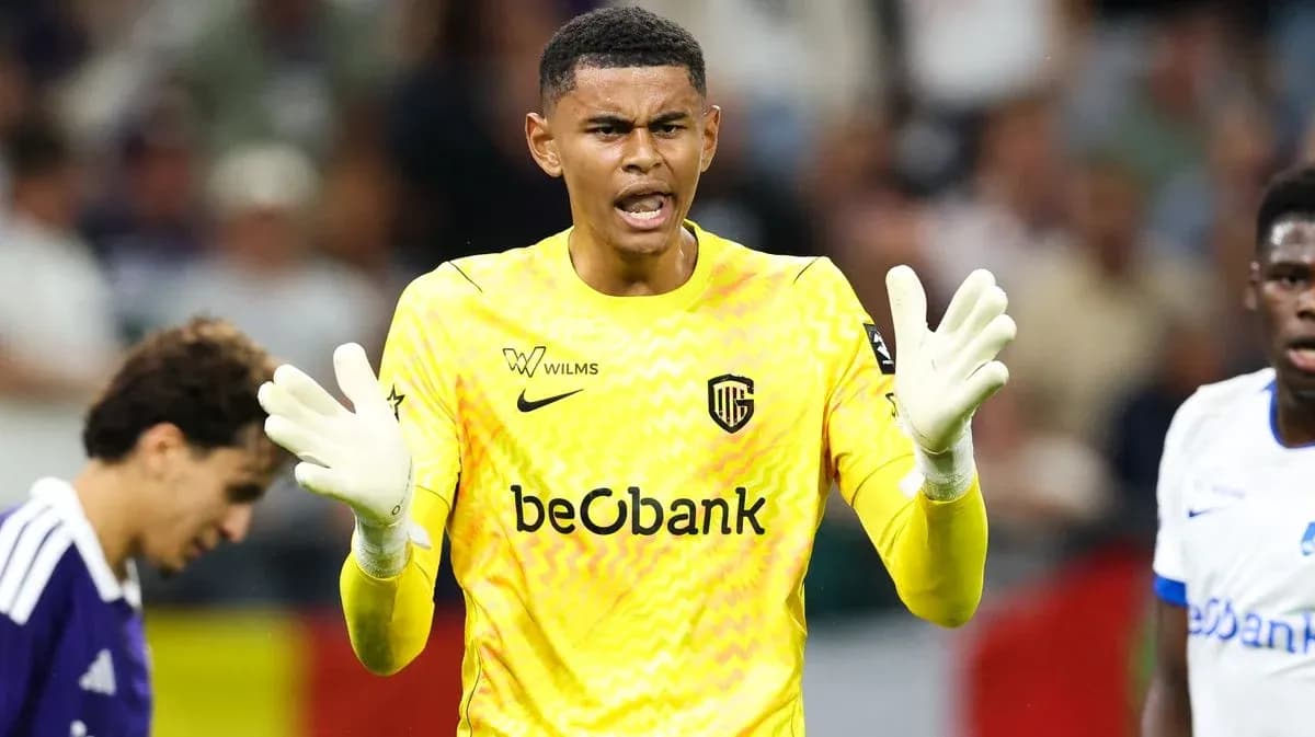 Goalkeeper in yellow jersey gesturing during match