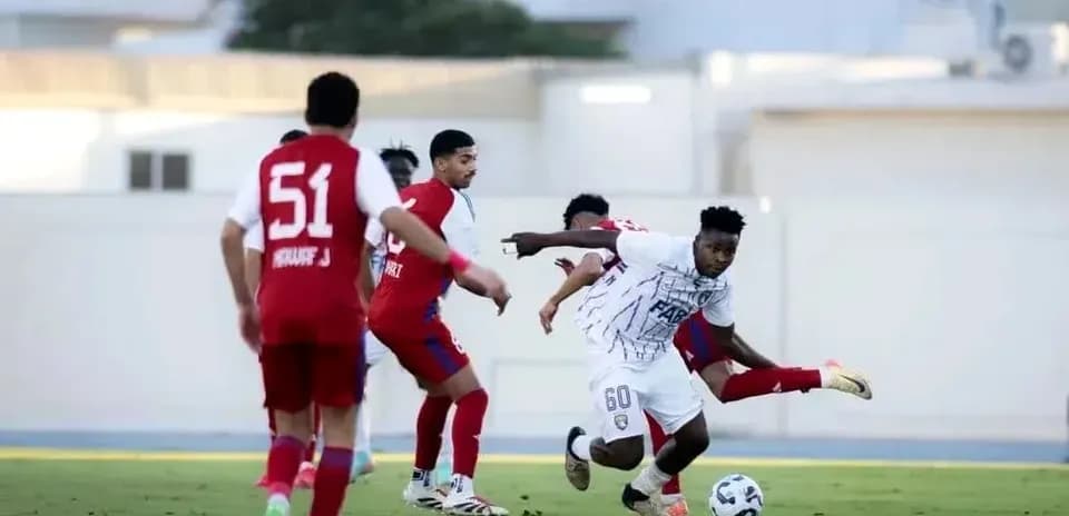 Al Dhafra U23 player dribbling past opponents