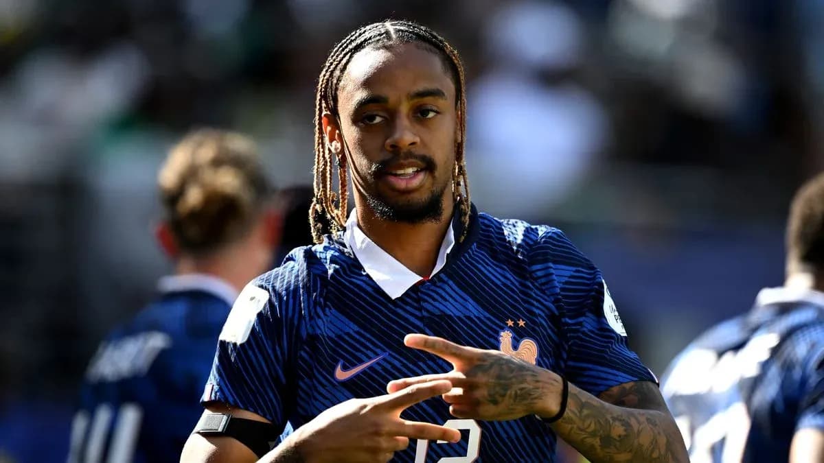 Player in France jersey gesturing during warm-up