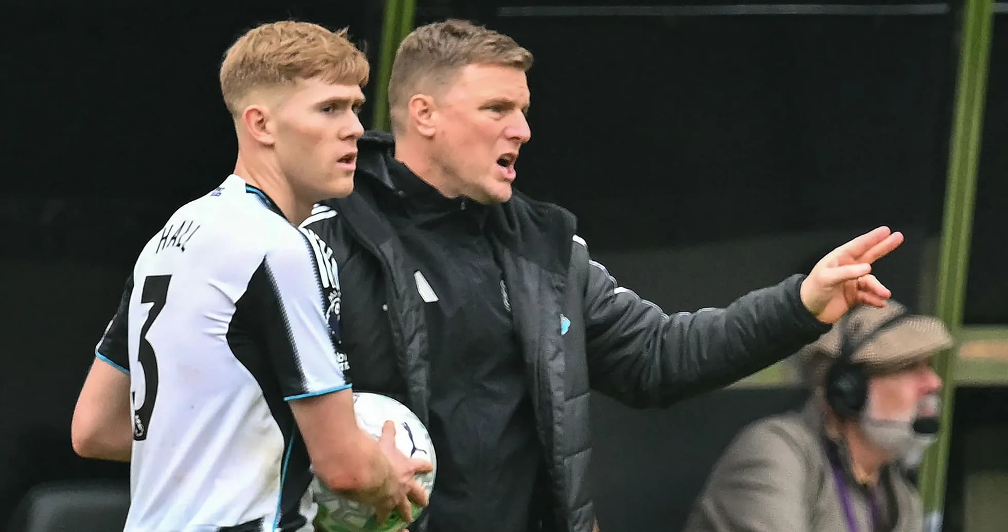 Coach instructing player during match substitution