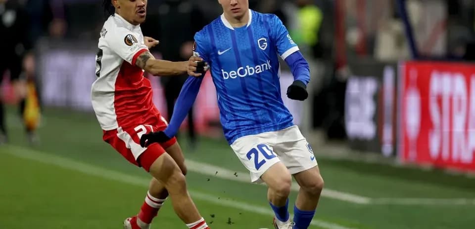 Two players competing for the ball on the field
