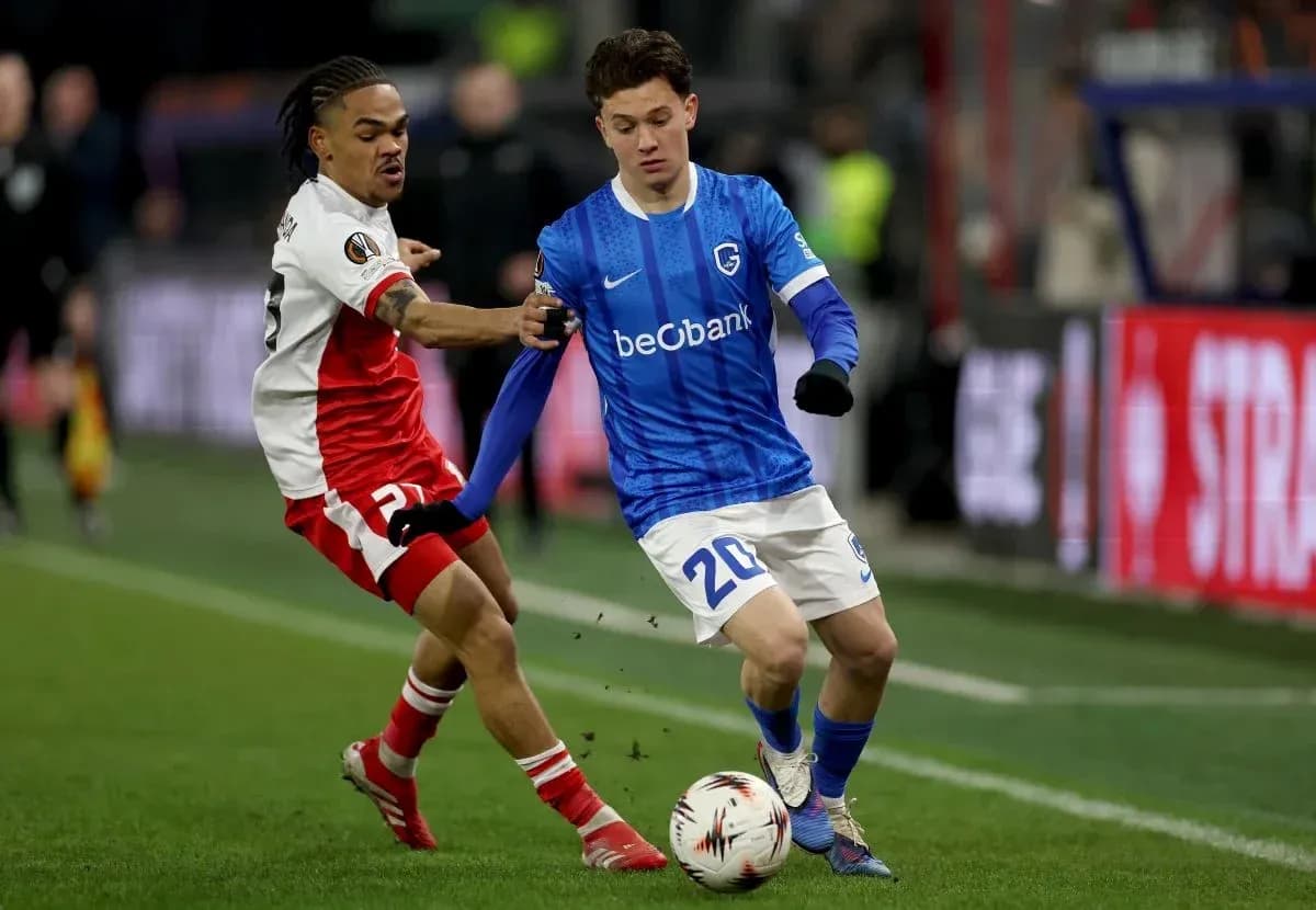 Two players competing for the ball on the field