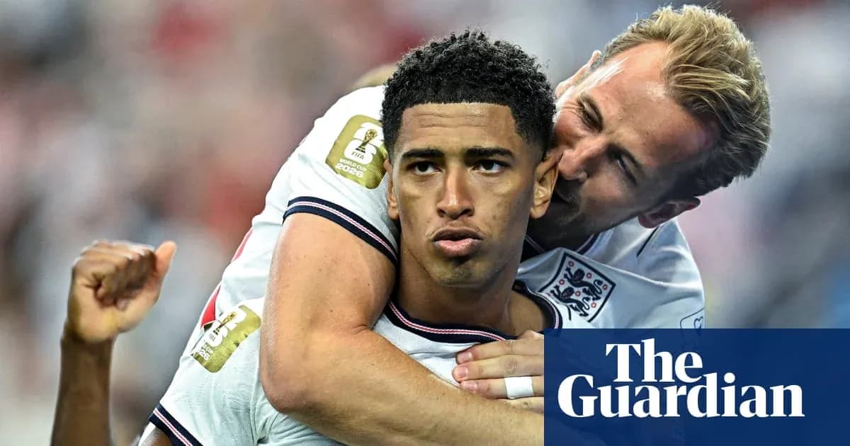 Two England players celebrating during a match