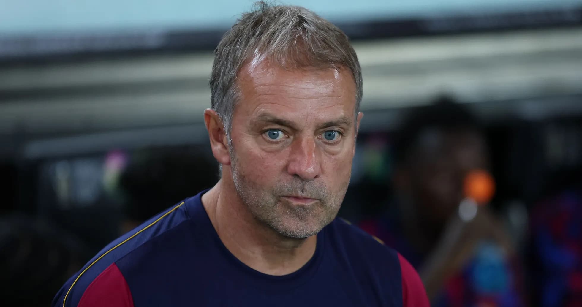 Coach sitting on the bench during match