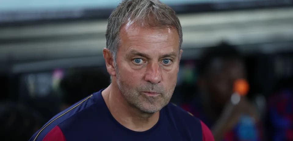 Coach sitting on the bench during match