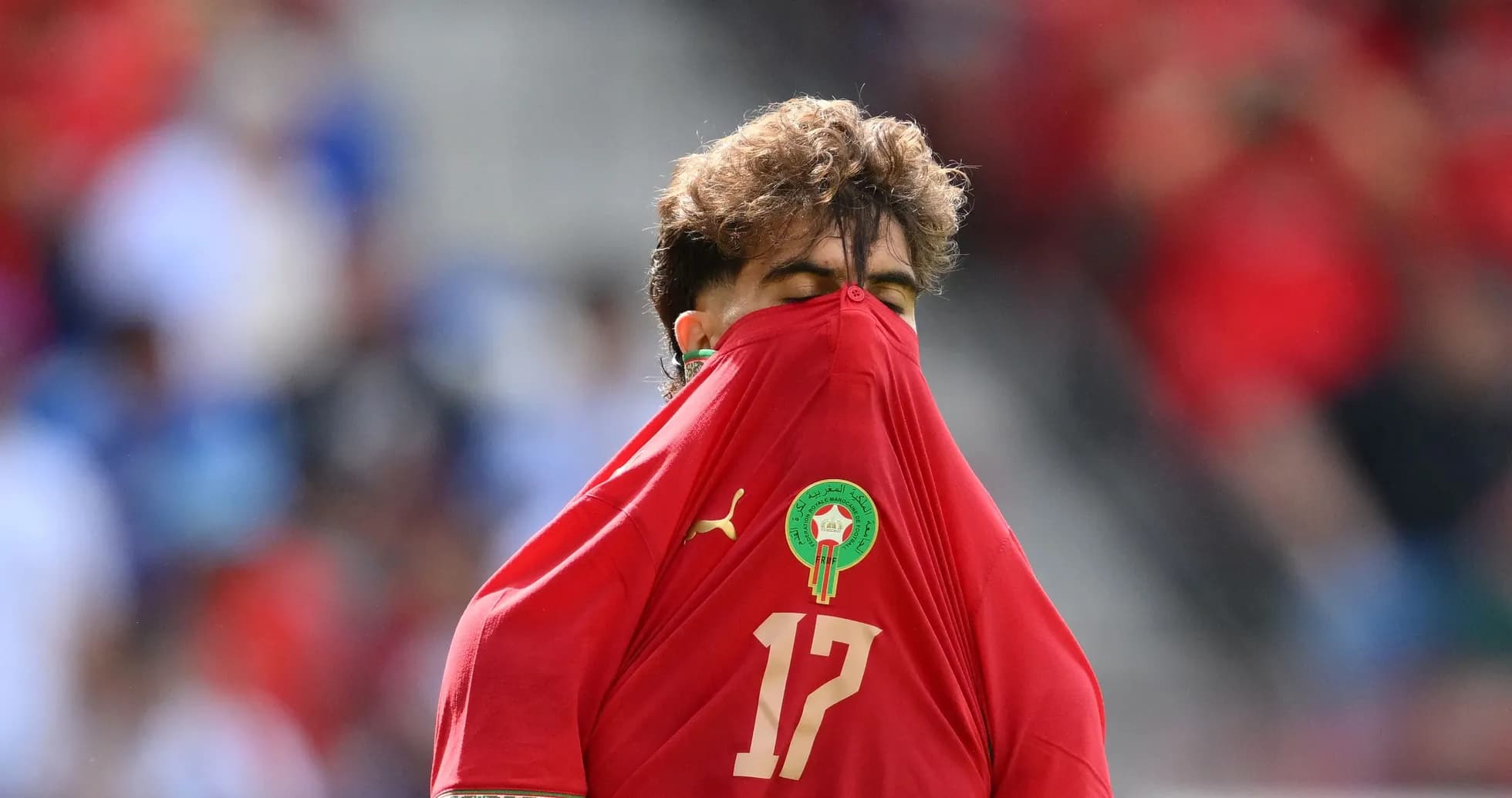 Player hiding face with jersey during match