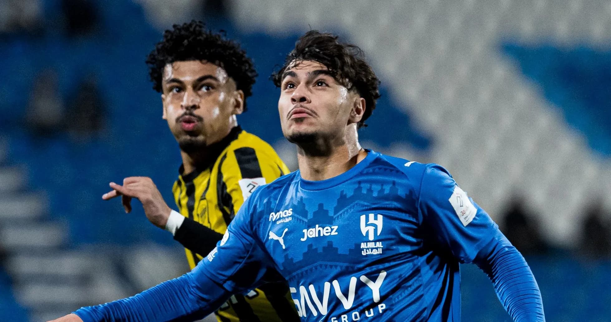 Two players competing during a football match