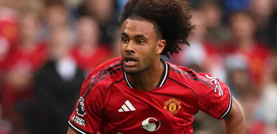 Player in Manchester United kit running on field