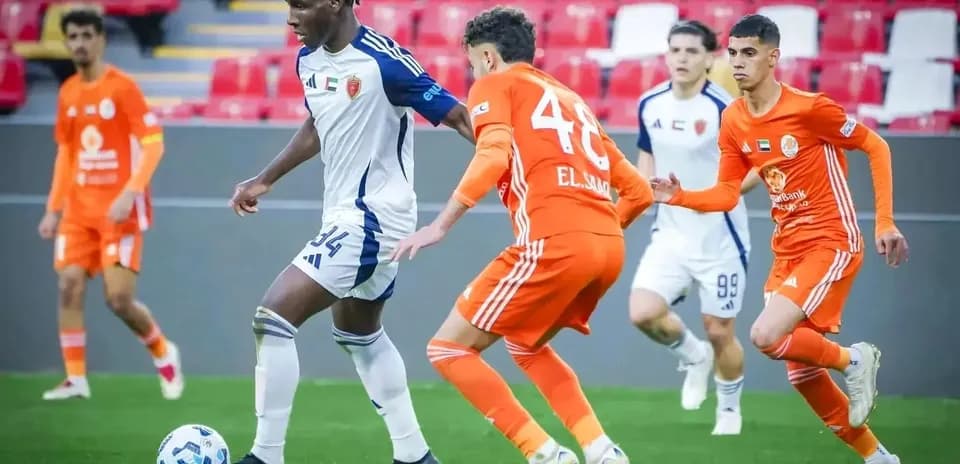 Al Bataeh U23 player dribbling past Shabab Al-Ahli U23