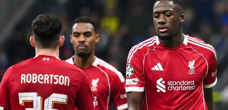 Liverpool players walking during a match