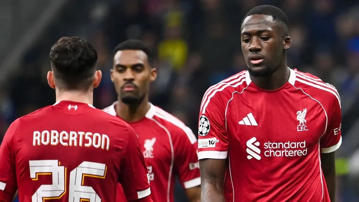 Liverpool players walking during a match
