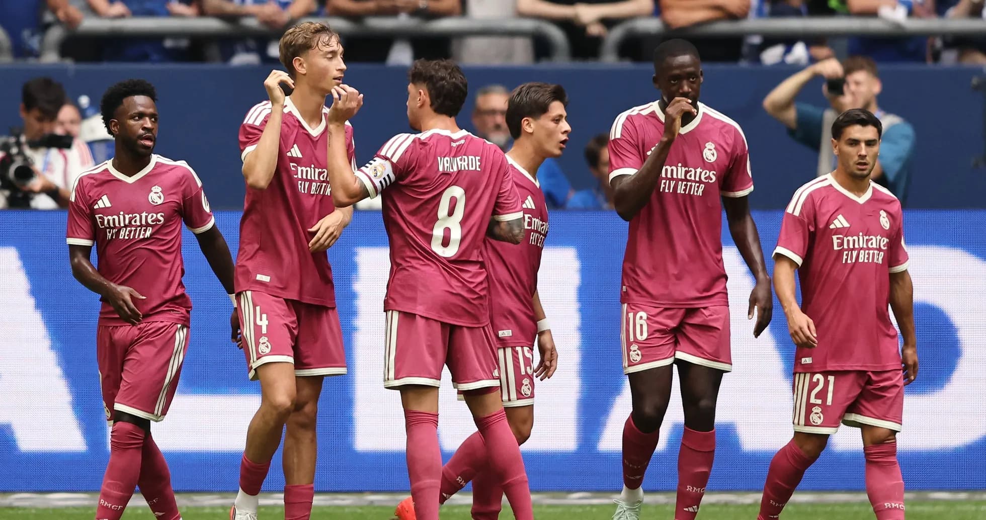 Real Madrid players celebrating a goal together