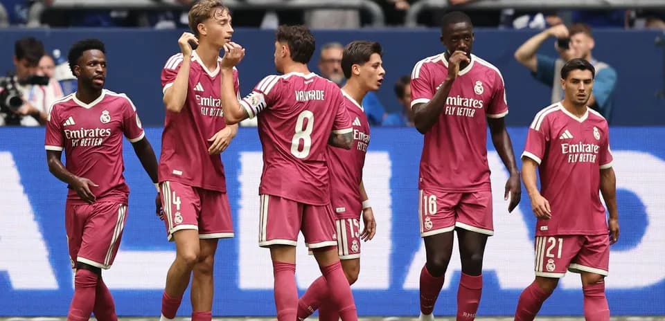 Real Madrid players celebrating a goal together