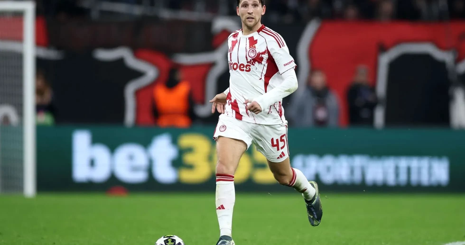 Olympiakos player dribbling during UEFA match
