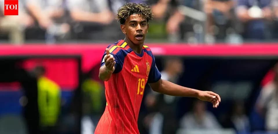 Player in red Spain jersey gesturing during match