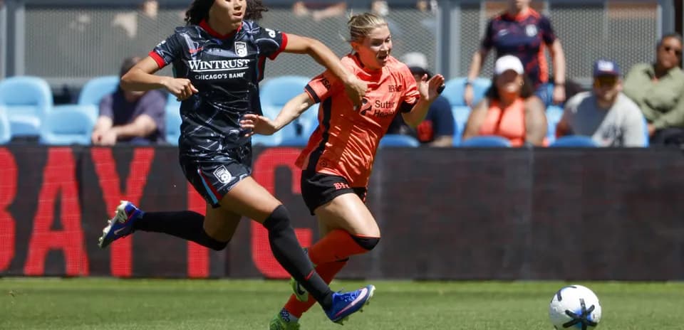 Players competing for the ball during match