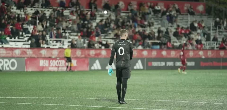 Goalkeeper preparing for action during match