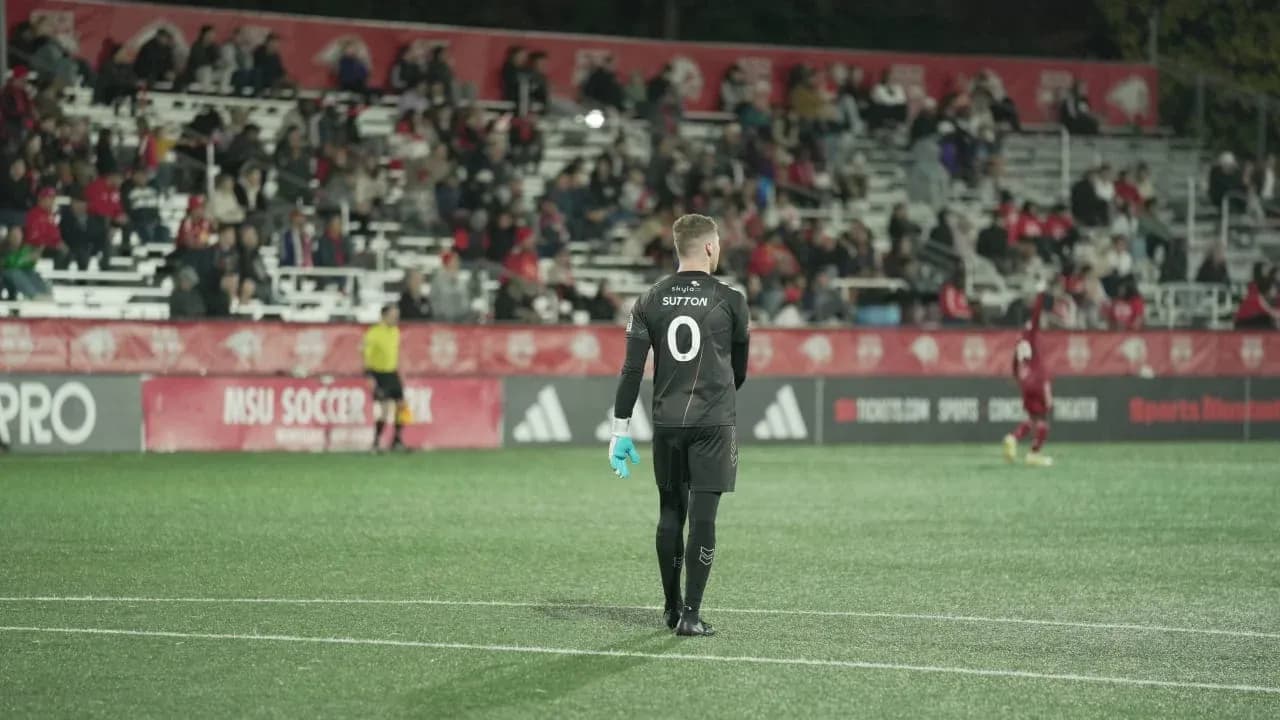 Goalkeeper preparing for action during match