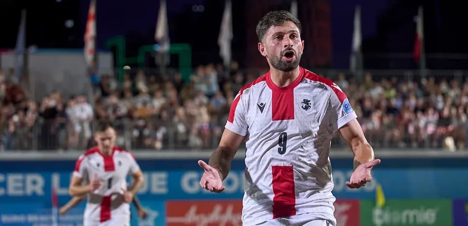 Player celebrating during beach soccer match