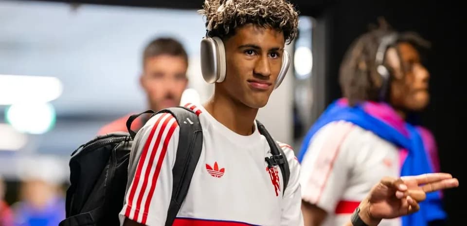 Player wearing headphones entering the stadium