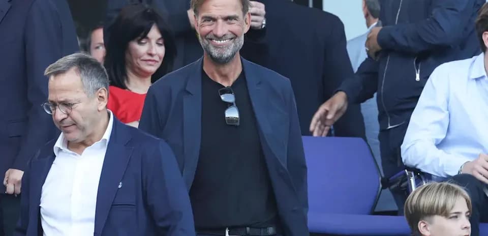 Jurgen Klopp smiling in a crowd at event