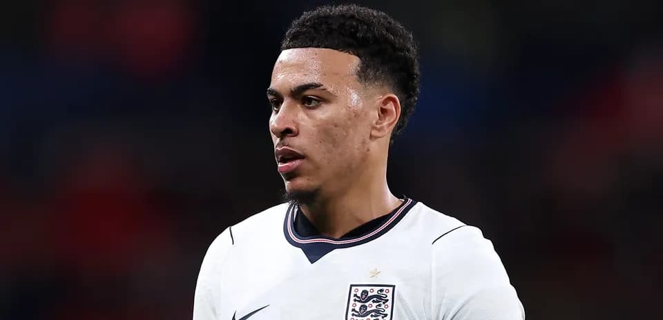 Football player wearing England kit during match