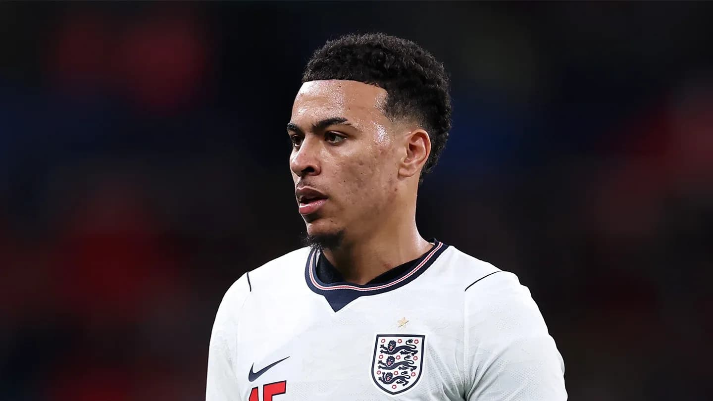 Football player wearing England kit during match