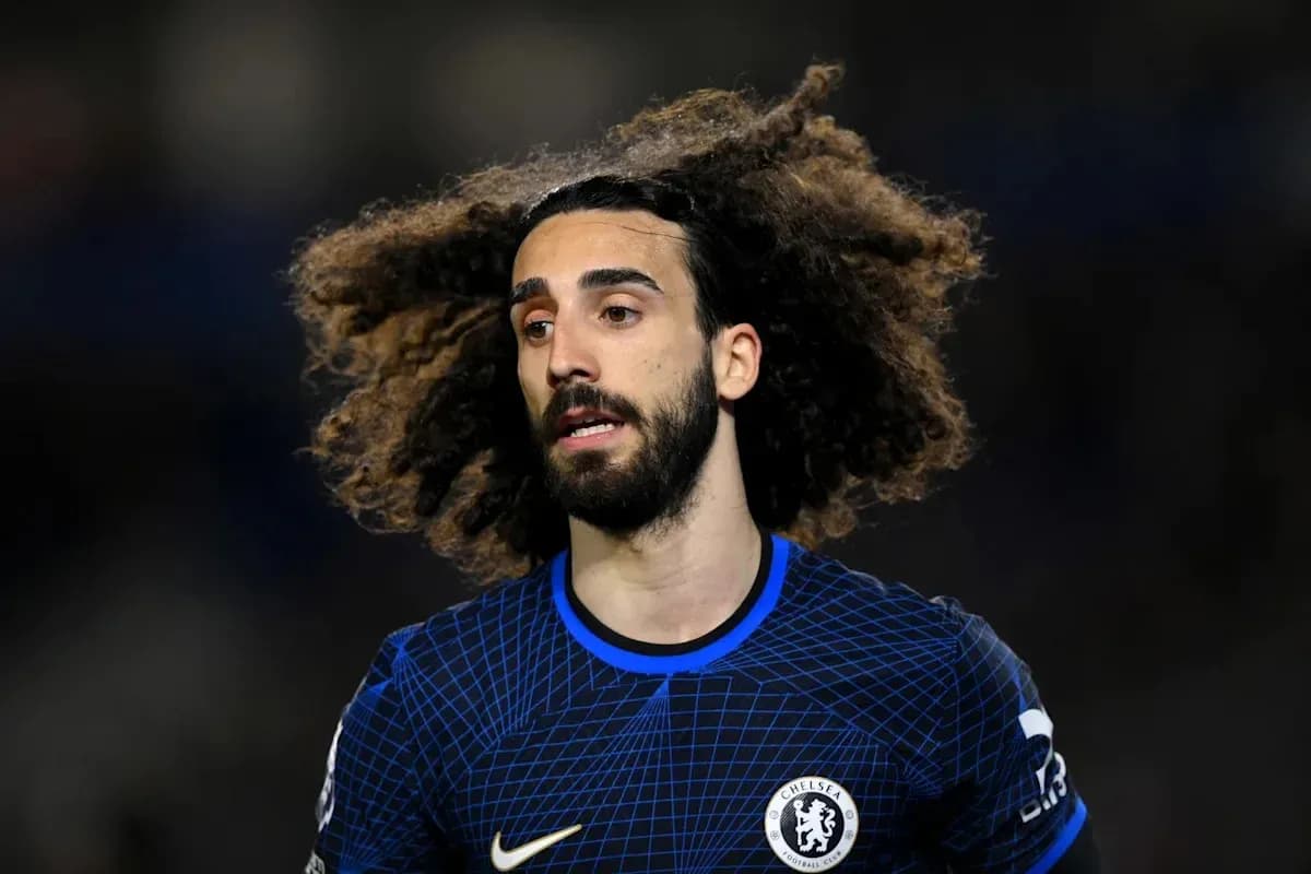 Player with curly hair wearing Chelsea jersey