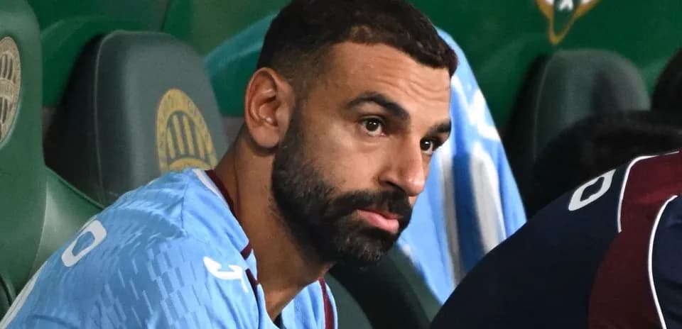 Player seated on bench during a match