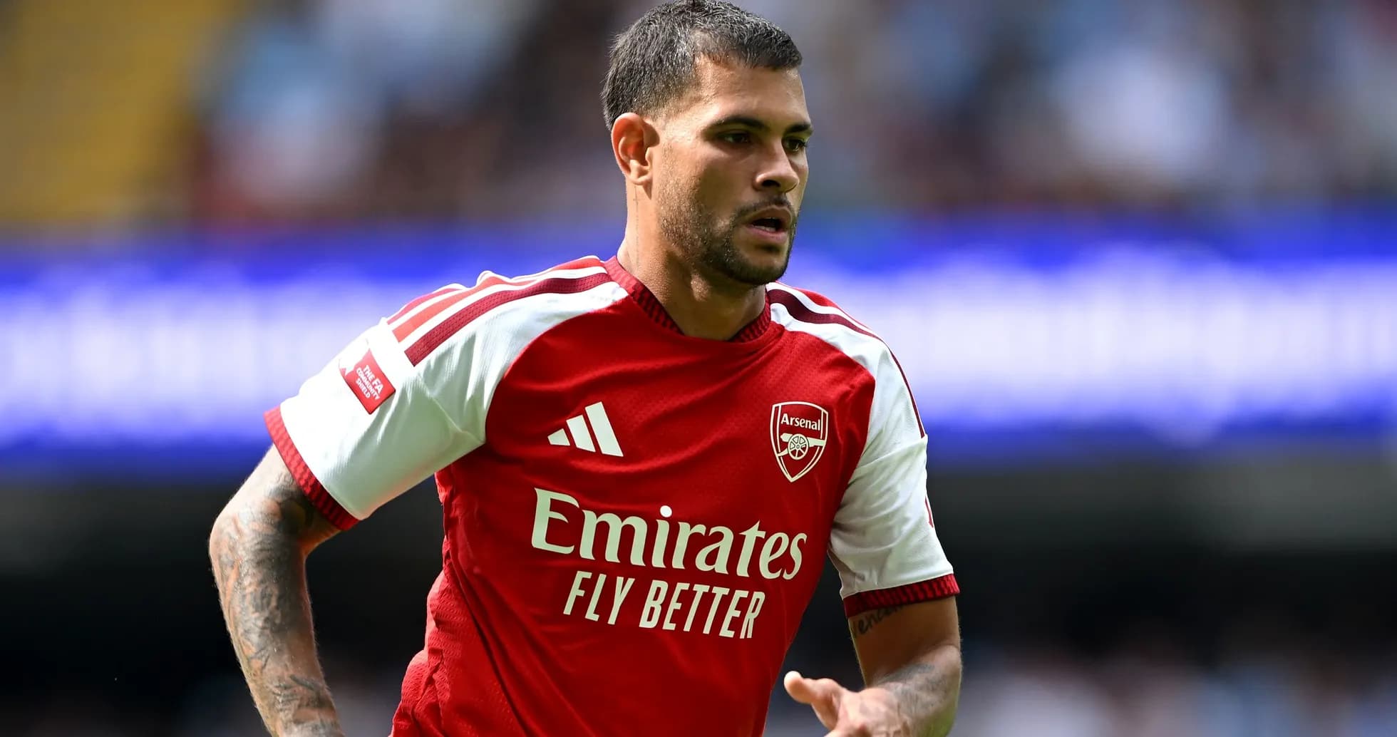 Player wearing Arsenal jersey during match action