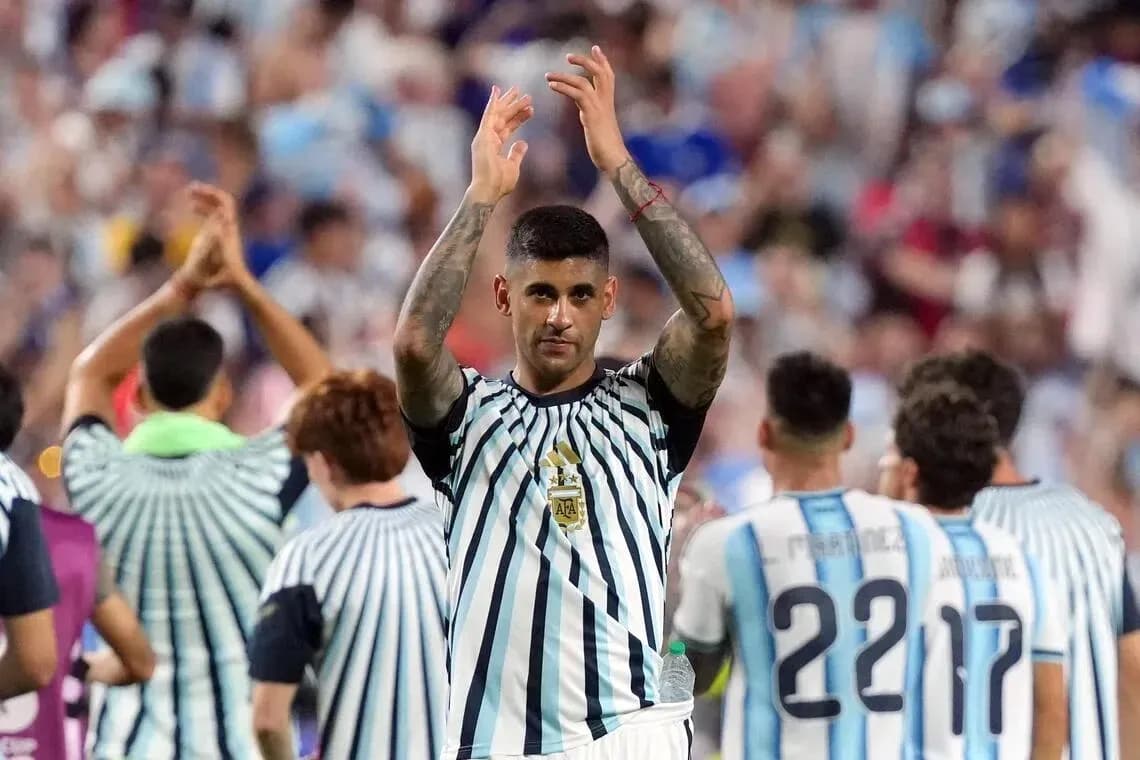 Player applauding fans after a match