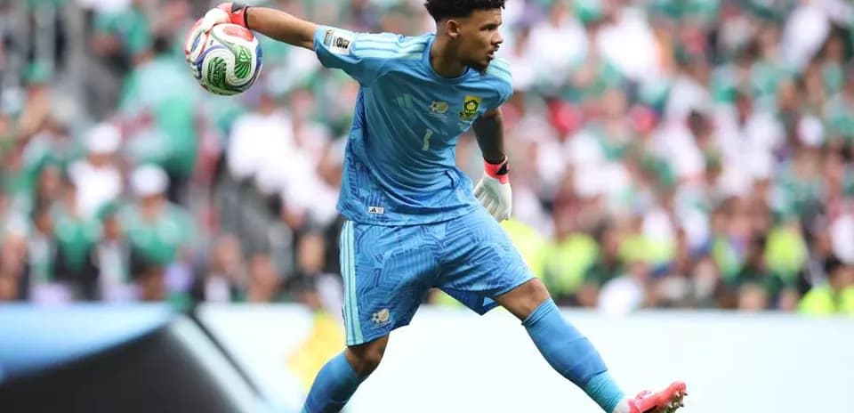 Goalkeeper preparing to throw the ball during match