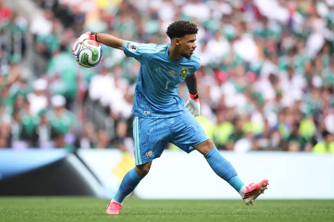 Goalkeeper preparing to throw the ball during match